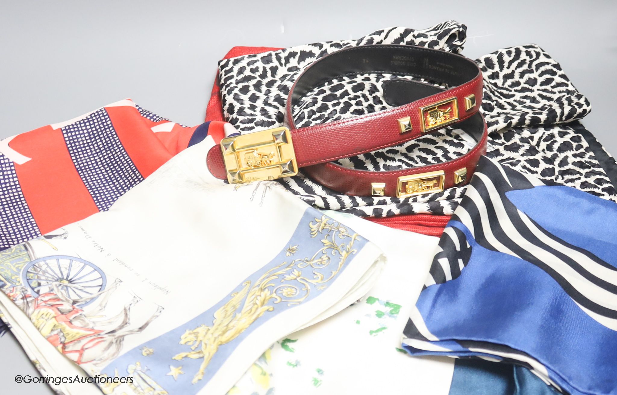 An Yves Saint Laurent black and white animal print silk top, a Laure de France leather belt and four vintage designer silk scarves